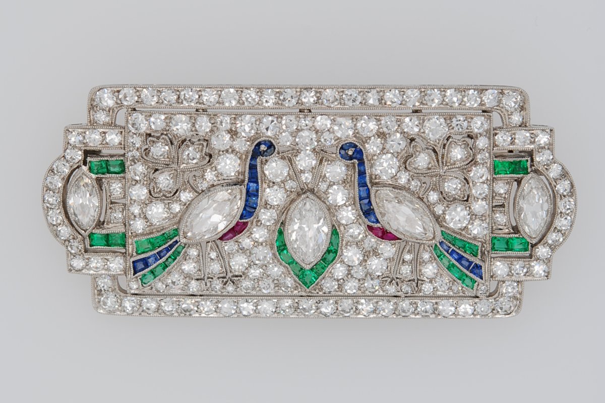 Antique Art Deco diamond brooch with two peacocks set with colored gemstones