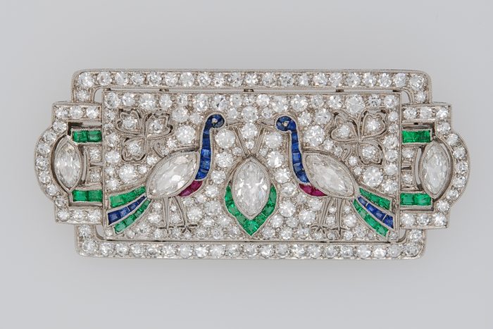 Art Deco diamond brooch with two peacocks set with colored gemstones